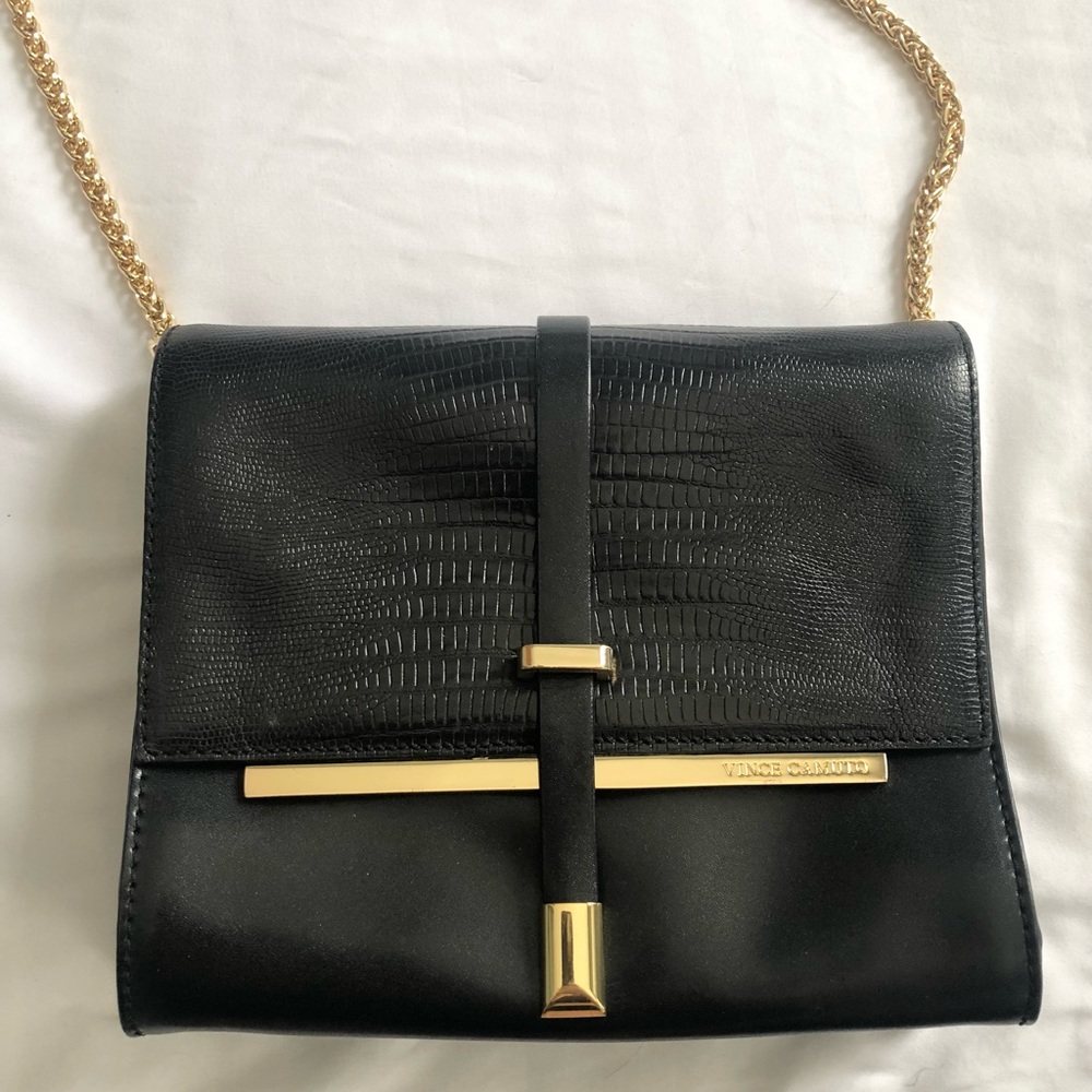 Vince Camuto black purse with gold accents in great condition!